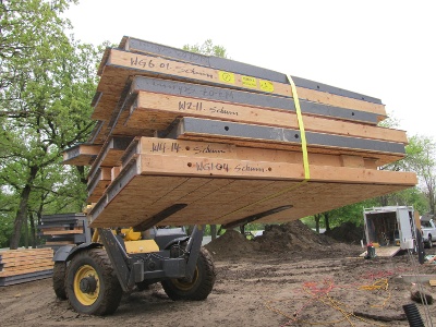 Moving stack of GPS Core SIP Panels At a Jobsite