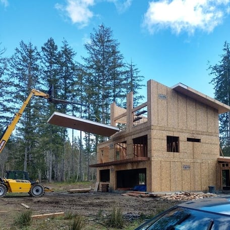 Scott Homes 2025 Build Roof Panel Flying in 3 Story Residence with Stenciled Logo LInkedIN