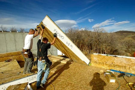 Premier SIPS wall panel arrives for install incorporating structure, insulation and sheathing in one. 